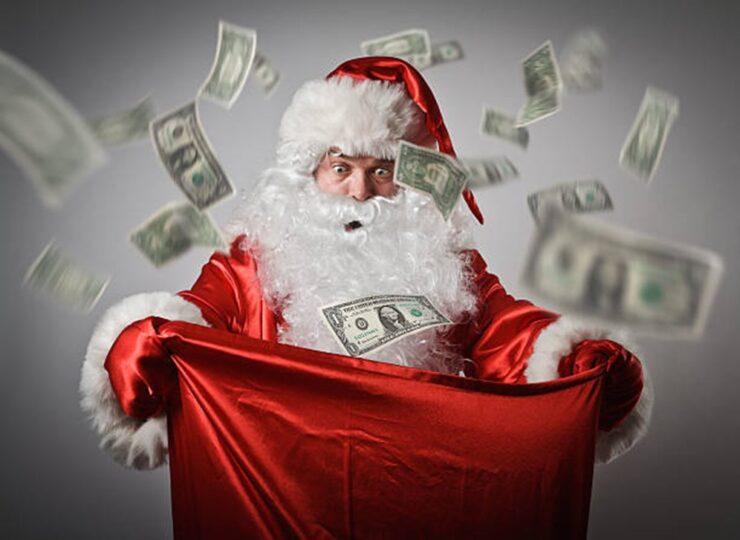 Santa holding a bag of money