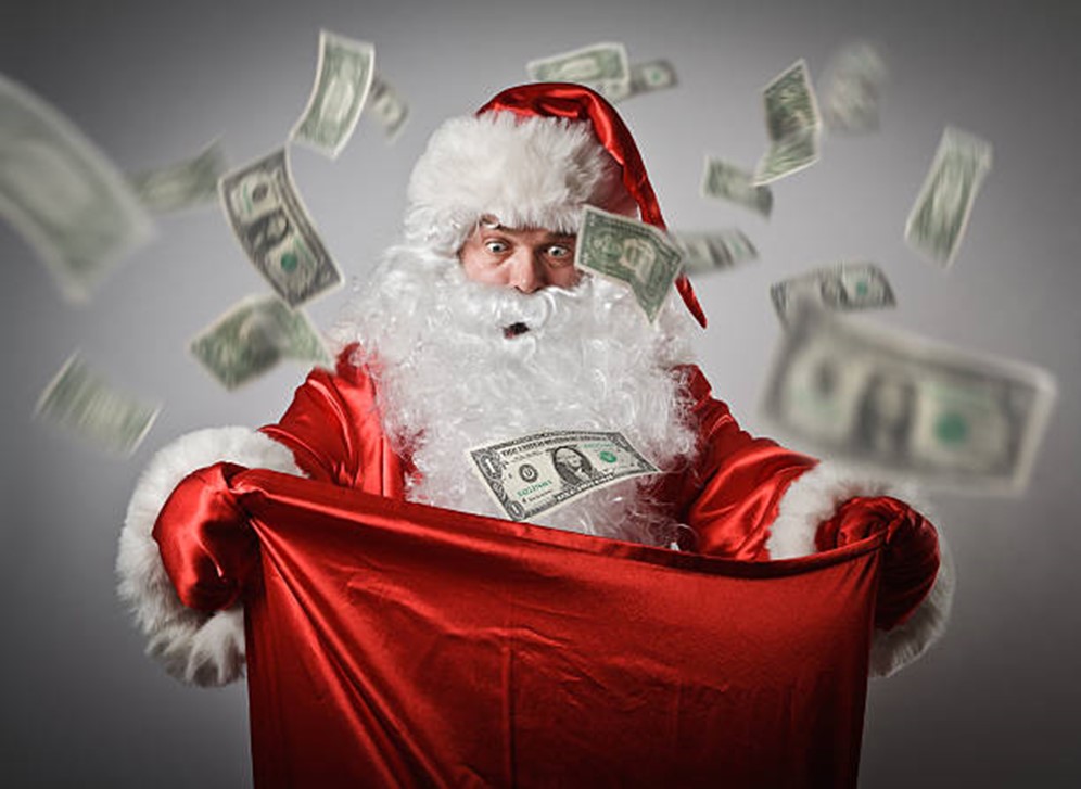 Santa holding a bag of money