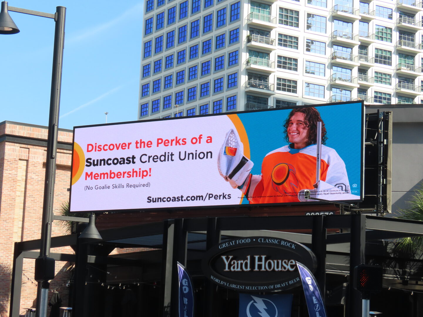 Billboard advertisement for Suncoast Credit Union, prominently displayed outdoors as part of an out-of-home advertising campaign secured for a client.